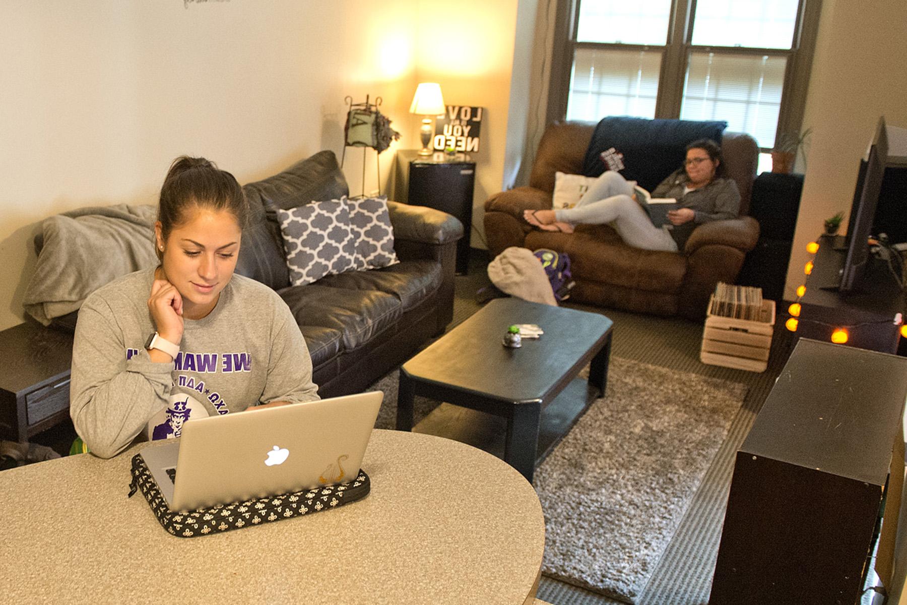 students sitting in suite housing